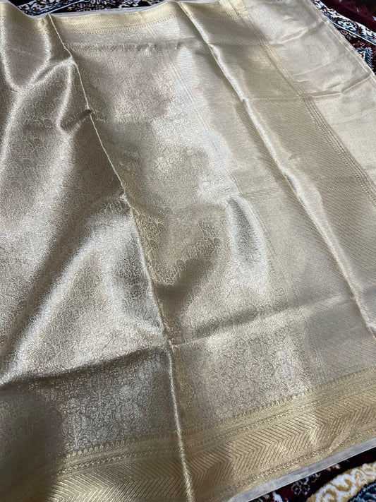 Manatavya Banaras golden brocade tissue silk saree with rich zari weaving, luminous sheen and regal traditional elegance