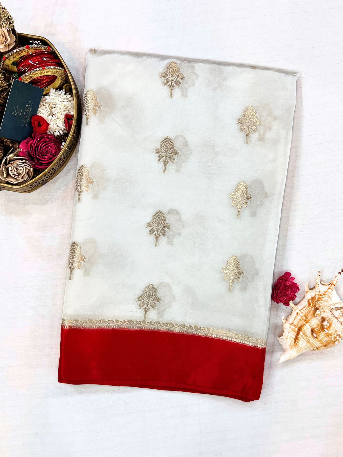 “White Devyani saree with classic embroidery and motifs”