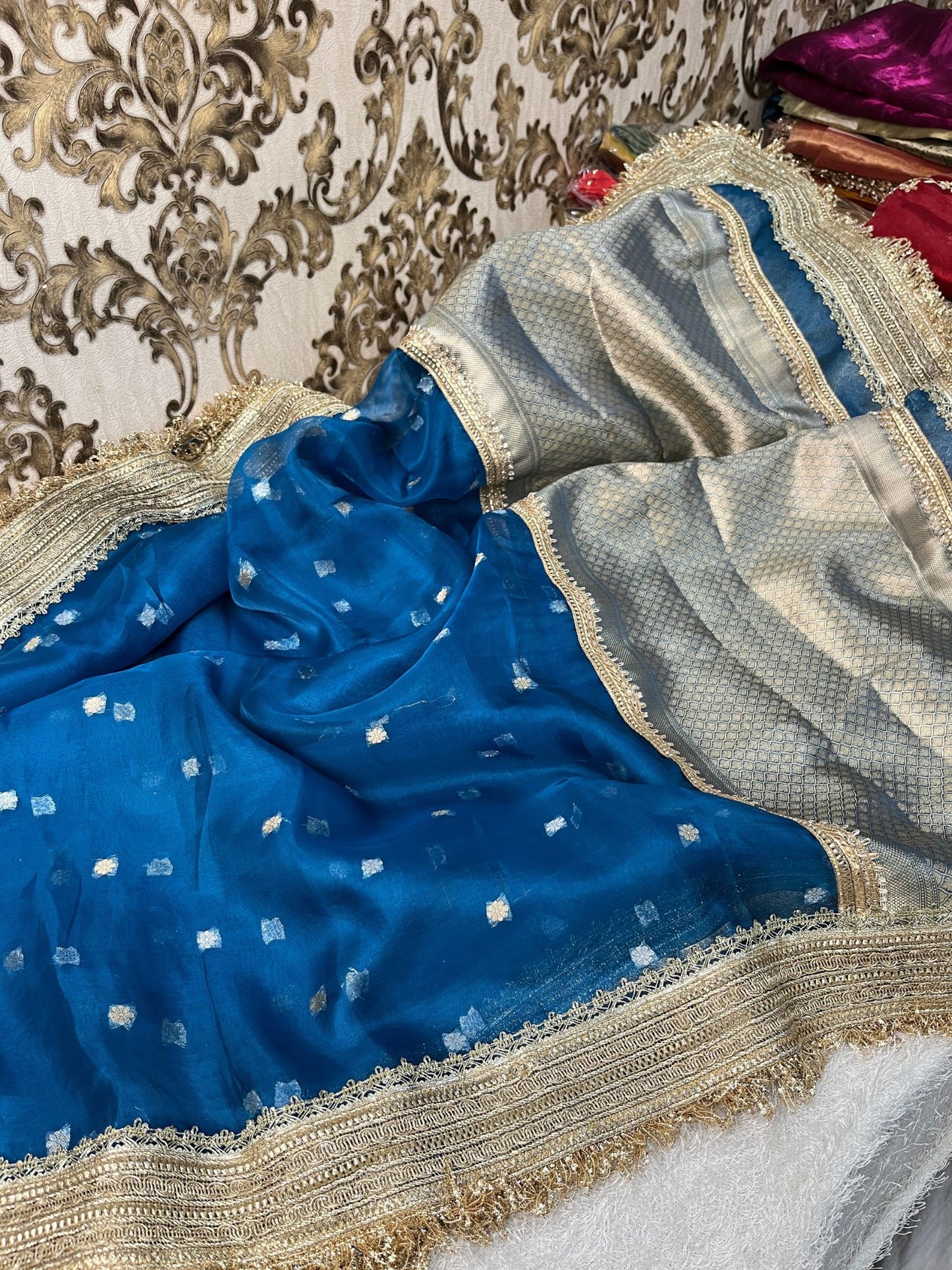 Blue buti Banarasi tissue silk saree with gota patti border, brocade aachal, and unstitched brocade blouse, handwoven in Varanasi.