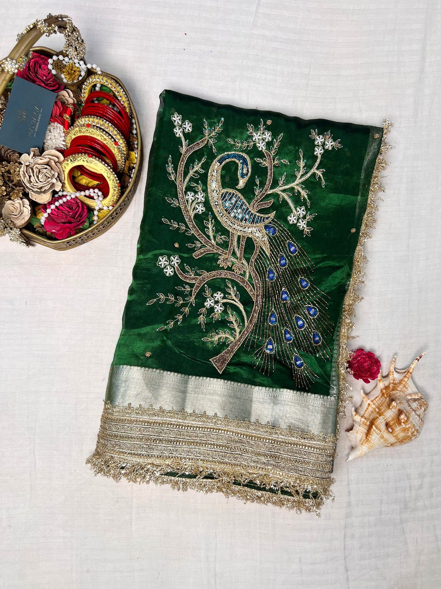βBottle Green Morni silk saree with intricate design and festive appealβ