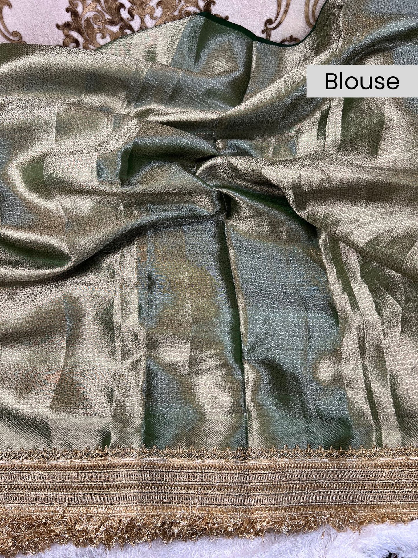 “Bottle Green Morni silk saree with intricate design and festive appeal”