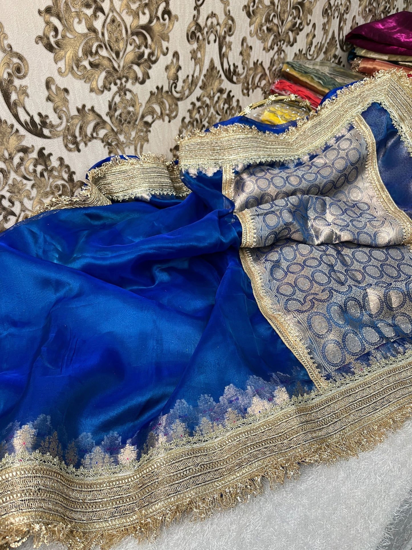 Royal blue pure Banarasi tissue silk saree with gota patti border, brocade aachal, and matching unstitched brocade blouse piece.