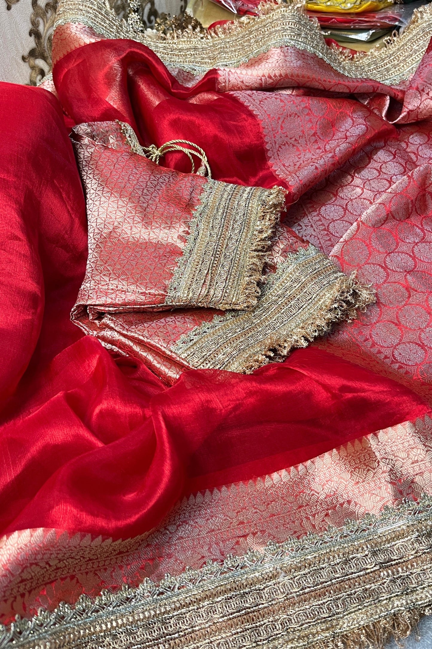 Royal Red Pure Banarasi Tissue Silk Saree with a soft sheen and unstitched brocade blouse, ideal for weddings and festive occasions.