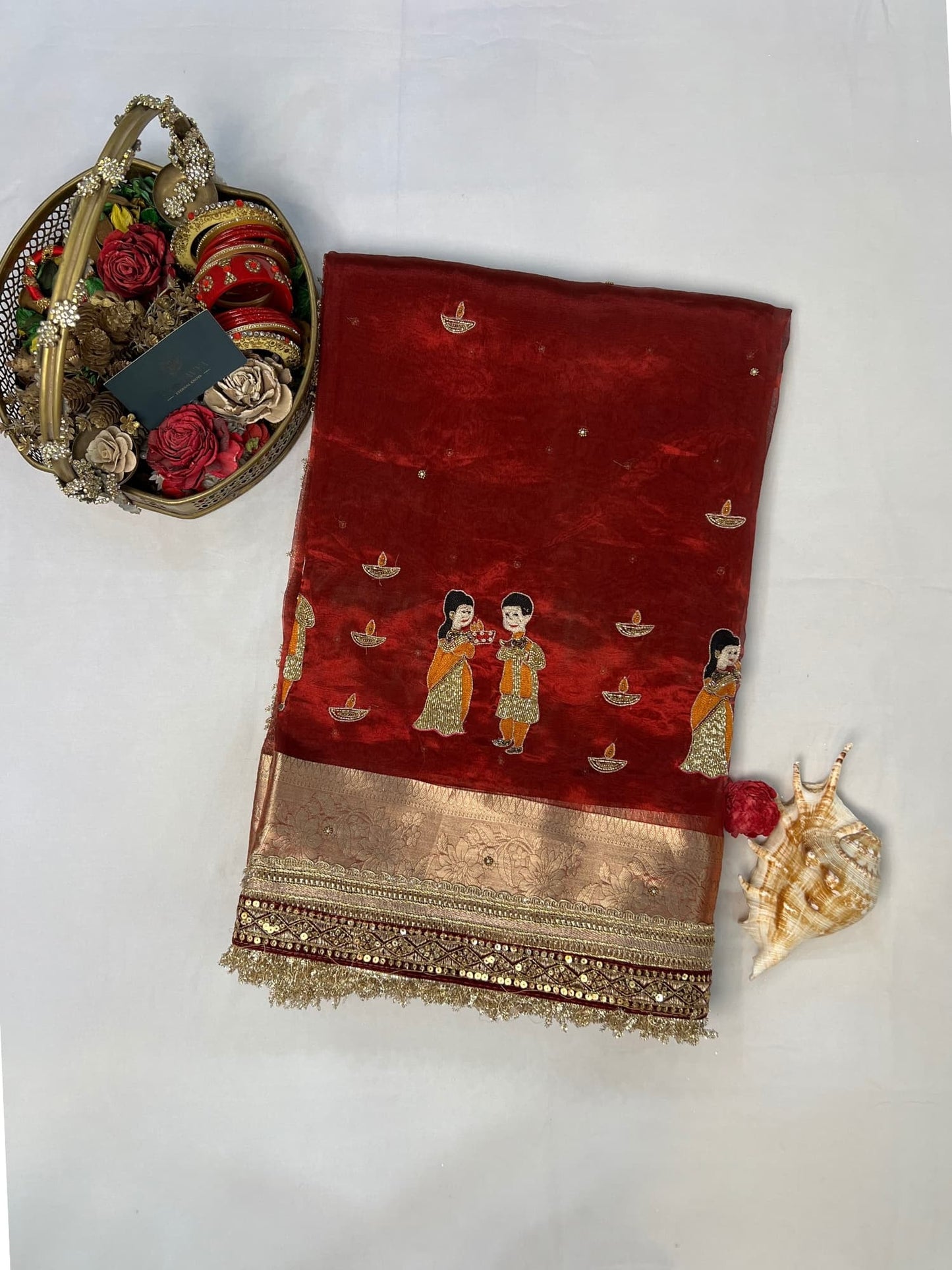 “Maroon Diwali saree with intricate traditional embroidery for festive celebrations”