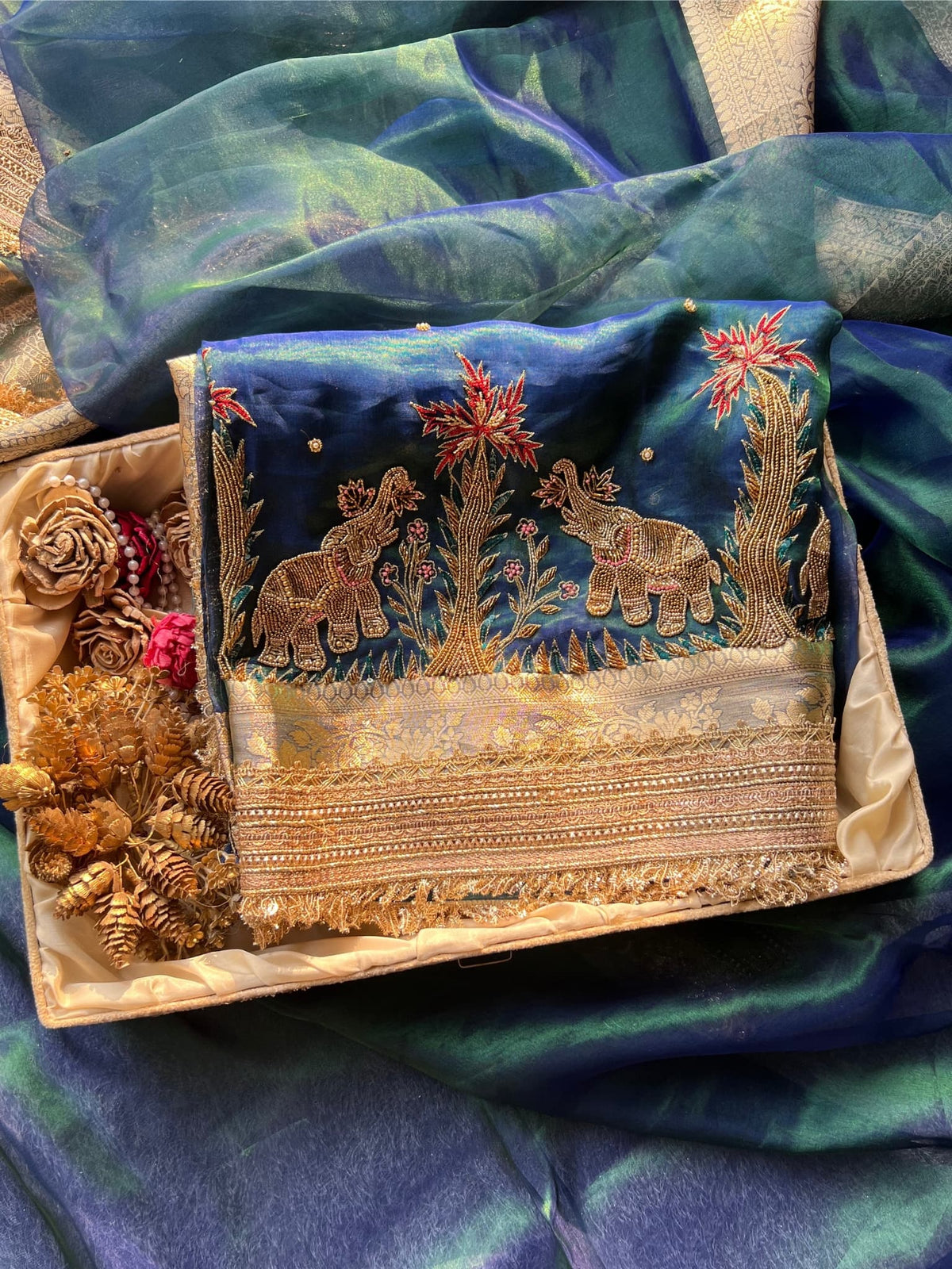 “Peacock Teal Blue Gajgamini saree with intricate embroidery and festive design”