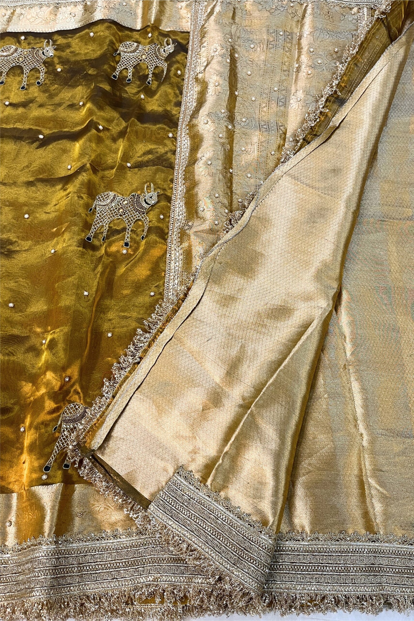 Hand Embroidered Mehndi Green Banarasi Tissue Silk Saree with Nandi buta and intricate detailing, perfect for weddings and festive occasions.