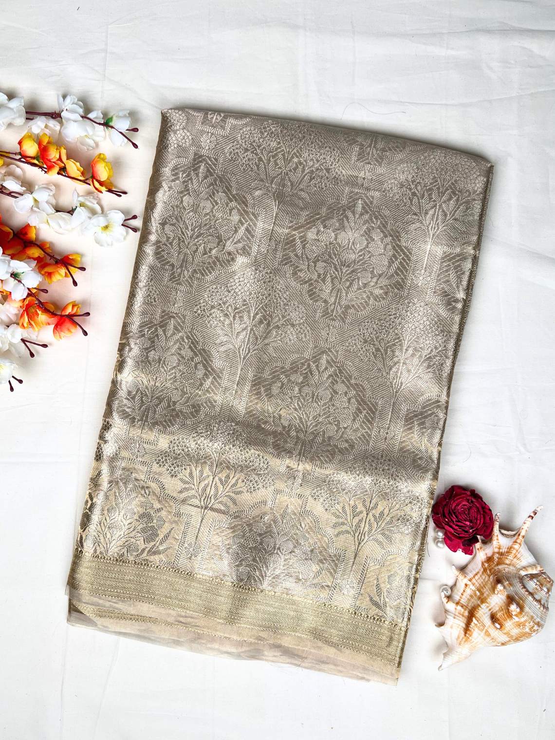 Manatavya Banaras golden brocade tissue silk saree with rich zari weaving, luminous sheen and regal traditional elegance