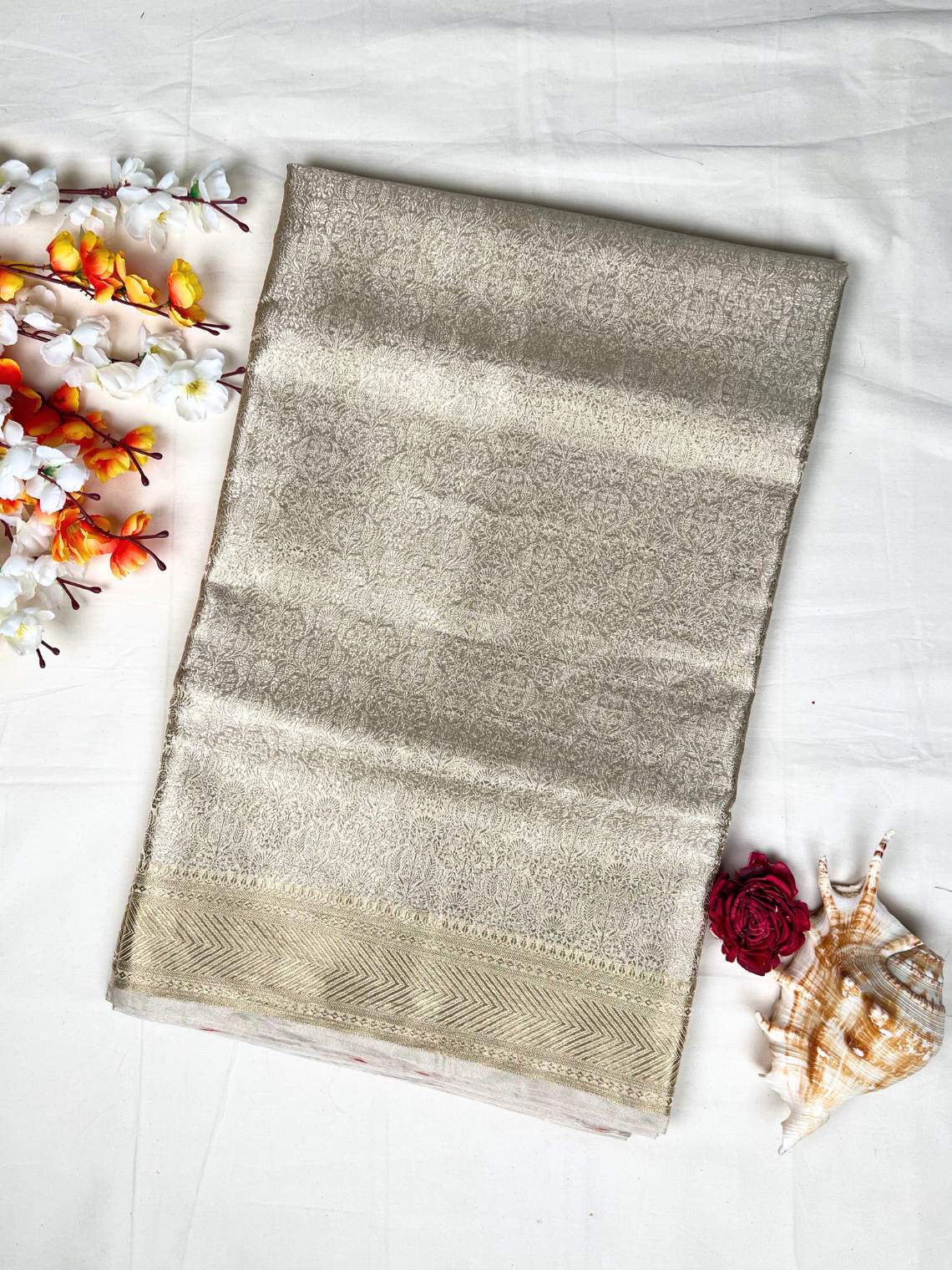Manatavya Banaras golden brocade tissue silk saree with rich zari weaving, luminous sheen and regal traditional elegance