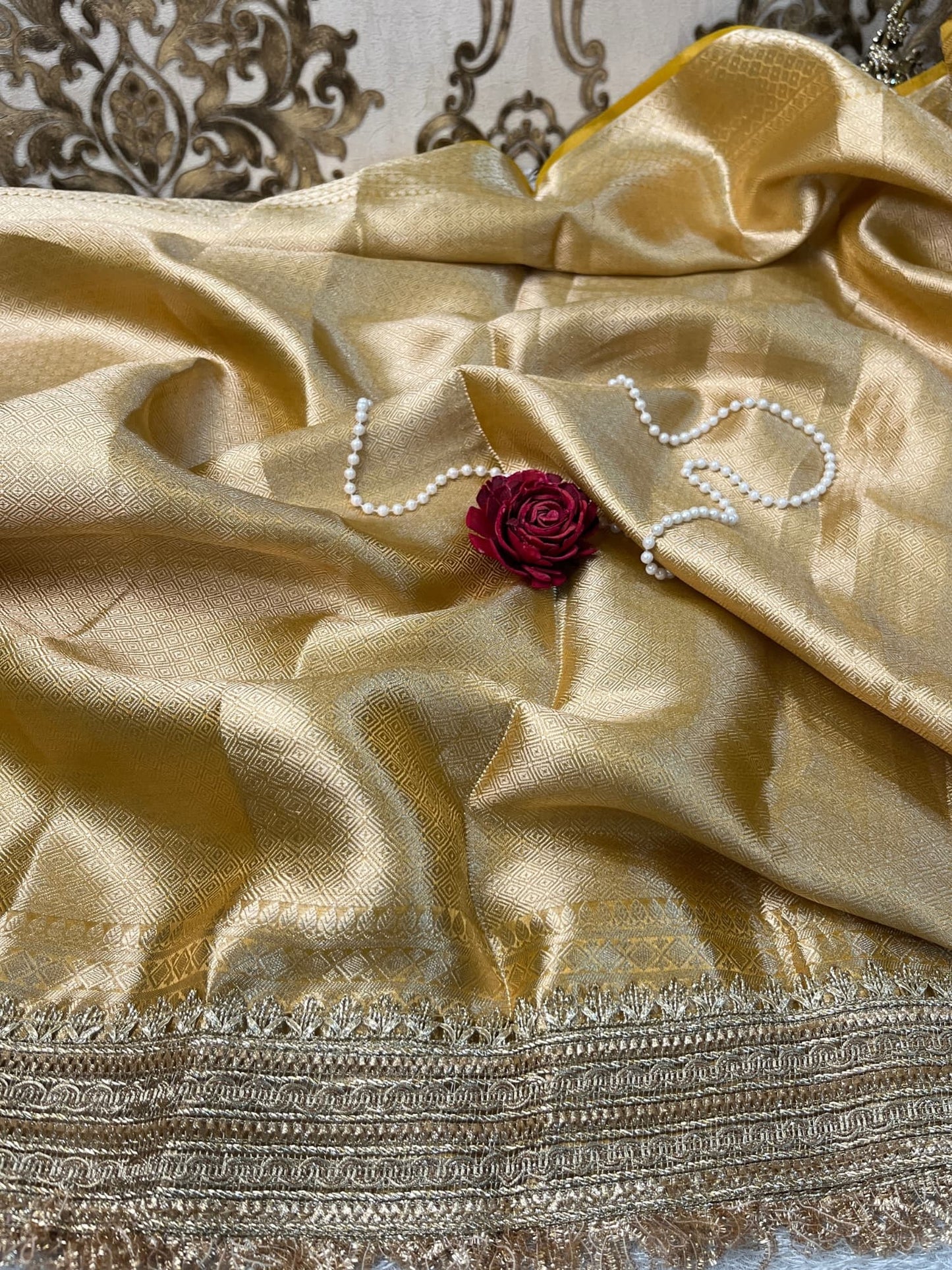 Yellow Tissue Silk Saree with hand-embroidered double parrot and leaf motifs, paired with a brocade blouse