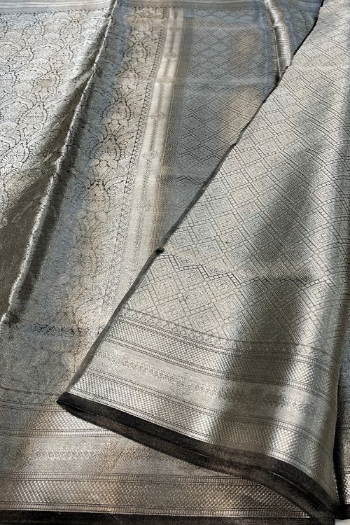 Black Brocade Tissue Silk Saree with intricate silver zari design and unstitched brocade blouse