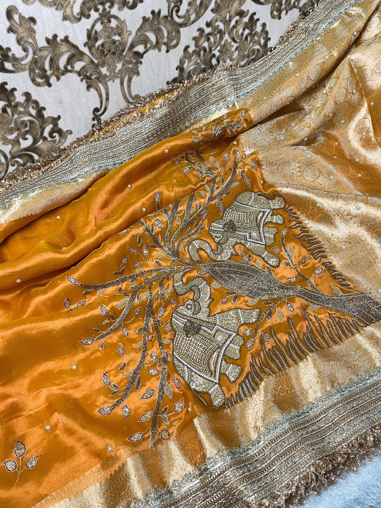 Yellow Tissue Silk Saree with twin elephant hand embroidery