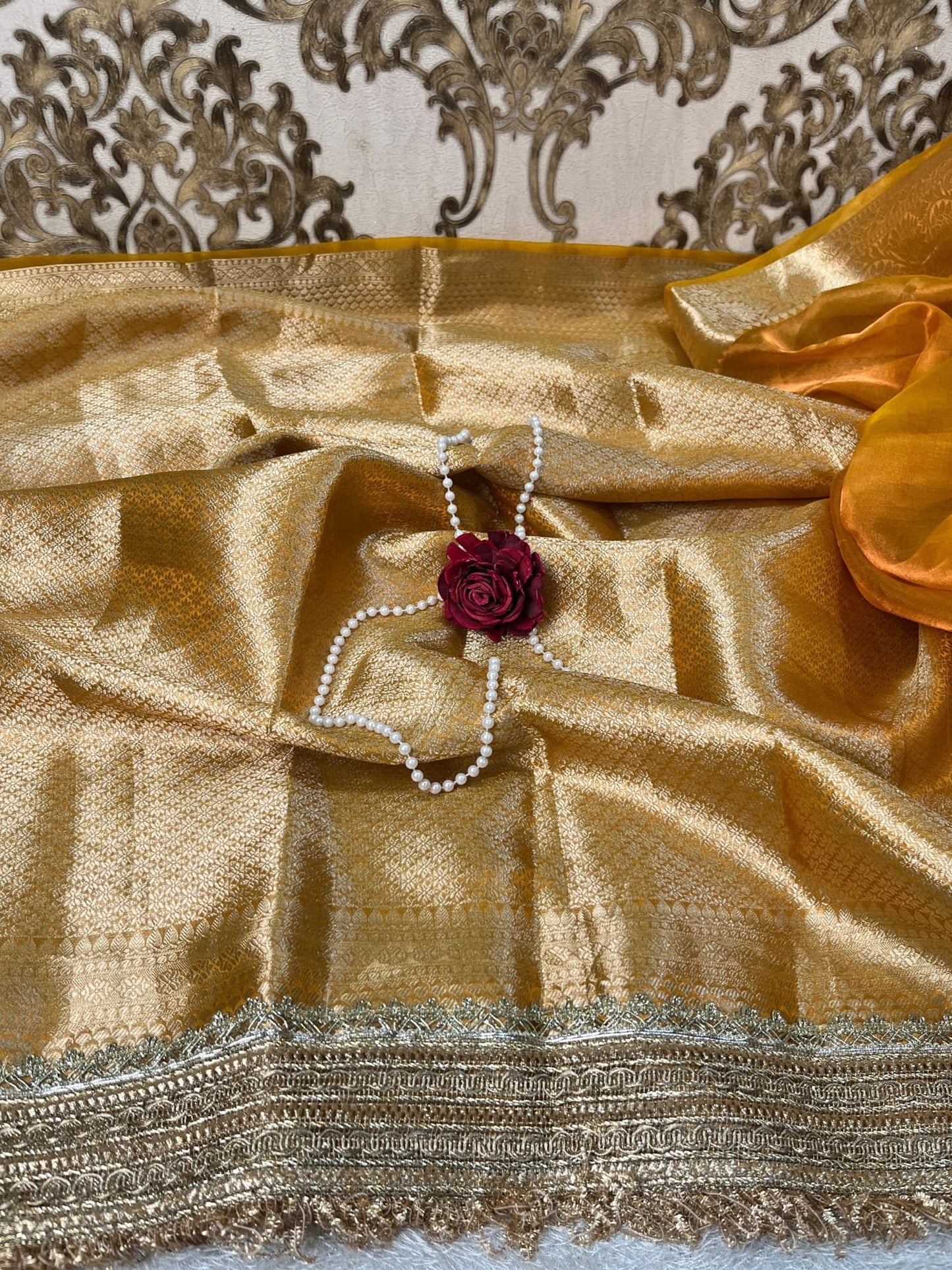 Yellow Tissue Silk Saree with twin elephant hand embroidery