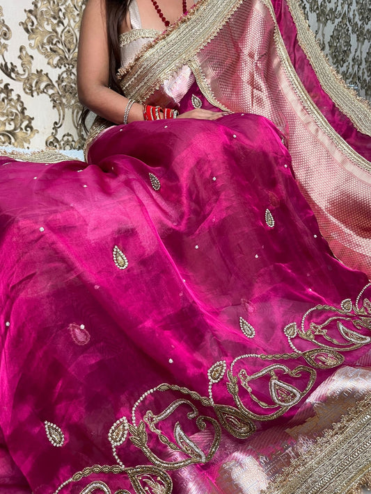 Hand-embroidered pink tissue silk saree featuring zari paisley motifs and a rich golden border by Mantavya Banaras