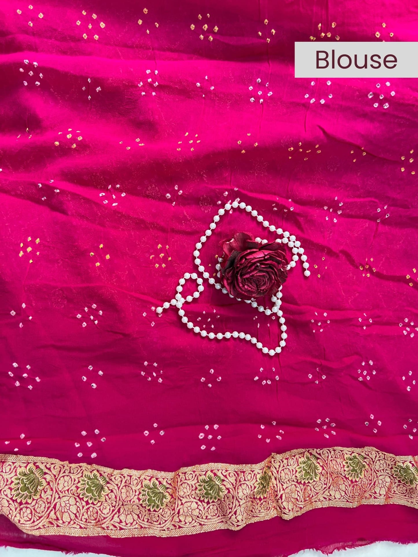 “Pink Bandhej saree with vibrant tie-dye design for festive wear”