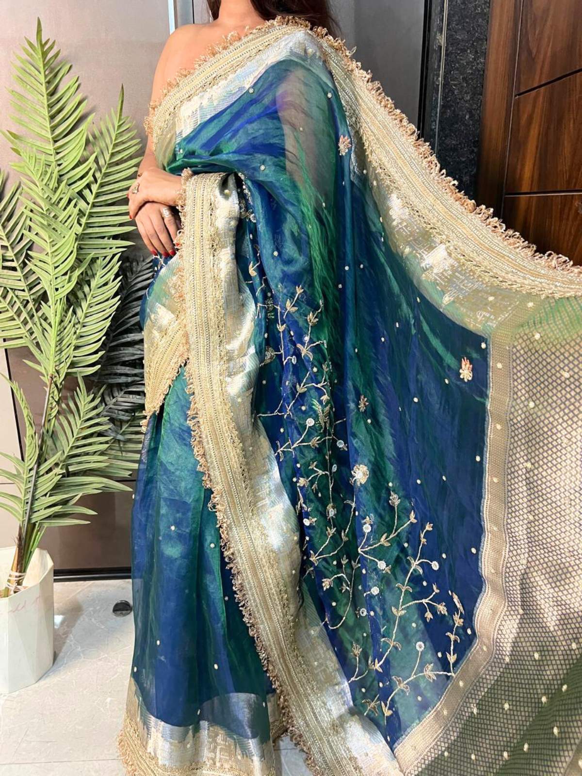 Peacock blue Gulmohar Banarasi silk saree with elegant floral design