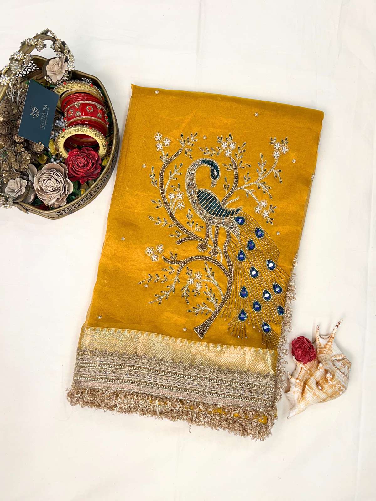Manatavya Banaras yellow Morni tissue silk saree with handwoven peacock motifs, lightweight drape and elegant festive design