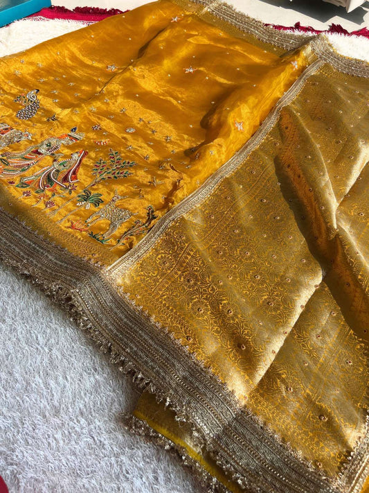 Manatavya Banaras yellow Radha Krishna saree featuring handwoven motifs, vibrant color and traditional festive design