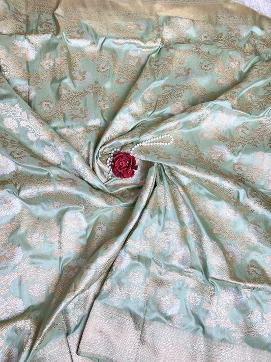 Manatavya Banaras pista green Katan silk saree fabric detail highlighting fine handwoven texture and lustrous silk finish