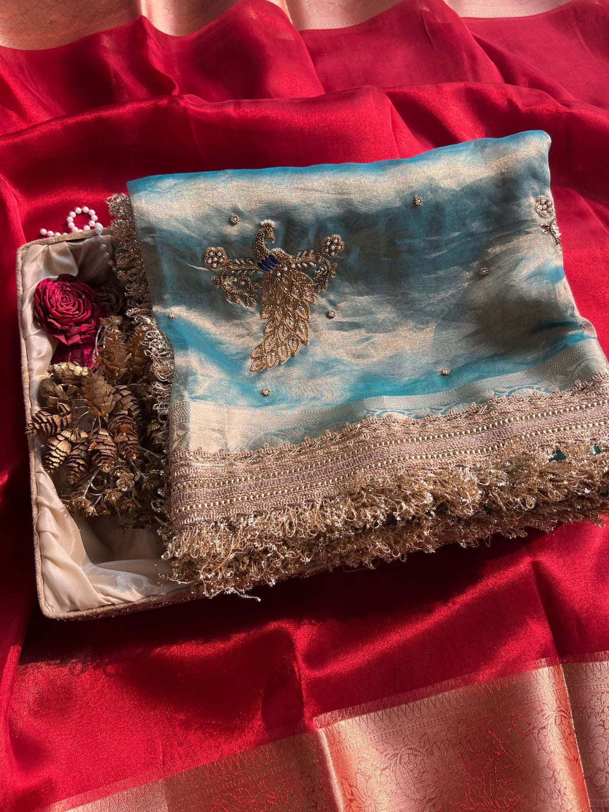 Manatavya Banaras powder blue Mayur saree with intricate peacock motifs, lightweight drape and traditional festive elegance