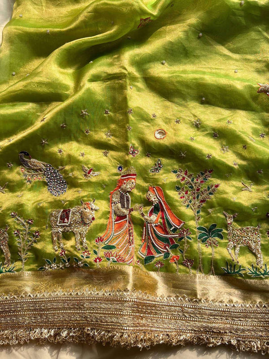 Pista green Banarasi Tissue Silk Radha Krishna with divine traditional artwork closeup view