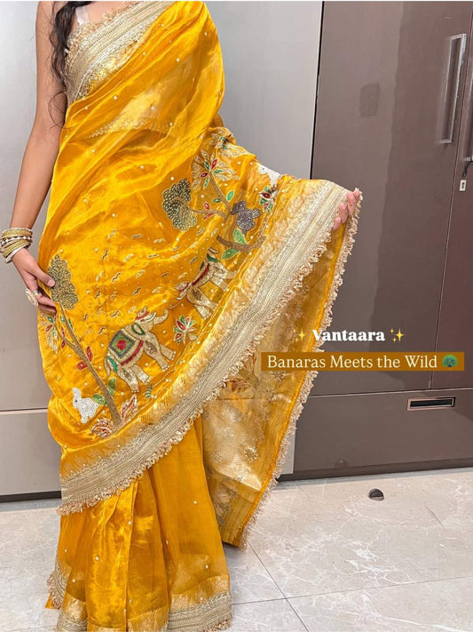 “Yellow Vantara festive Indian saree with vibrant color”