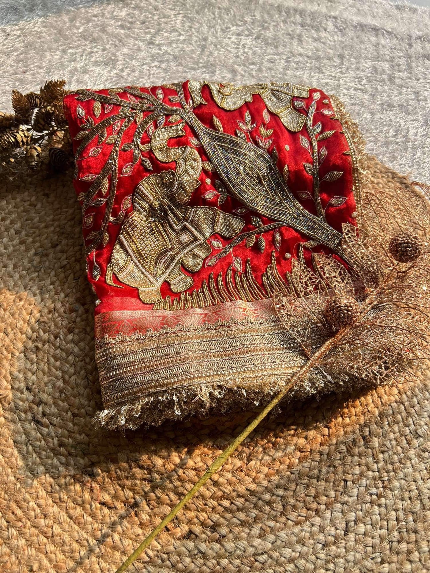 Manatavya Banaras red Gajanan pure Banarasi hand-embroidered tissue silk saree with intricate zari work, traditional motifs and elegant bridal design