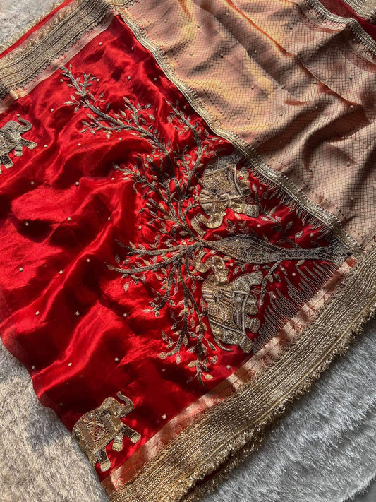 Manatavya Banaras red Gajanan pure Banarasi hand-embroidered tissue silk saree with intricate zari work, traditional motifs and elegant bridal design