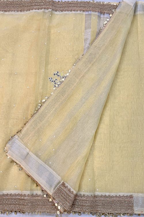 Hand-Embroidered Light Yellow Linen Tissue Silk Saree with Floral Motifs and Zari Lace Border