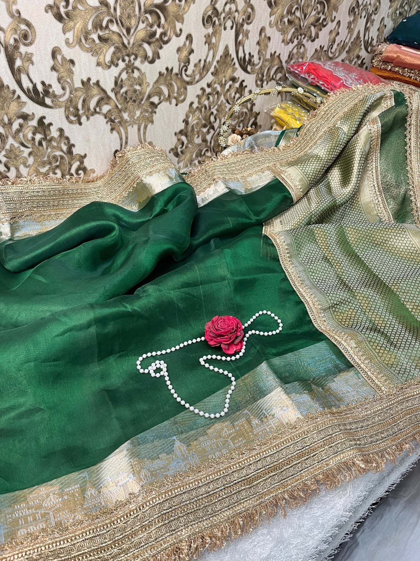 Bottle green pure Banarasi tissue silk saree with gota patti border, rich brocade aachal, and matching unstitched brocade blouse piece.