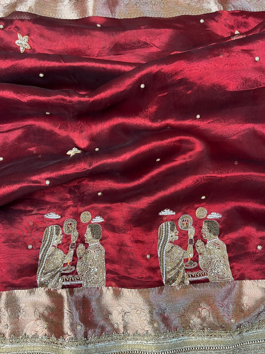 “Maroon Karwa Chauth saree with festive detailing”