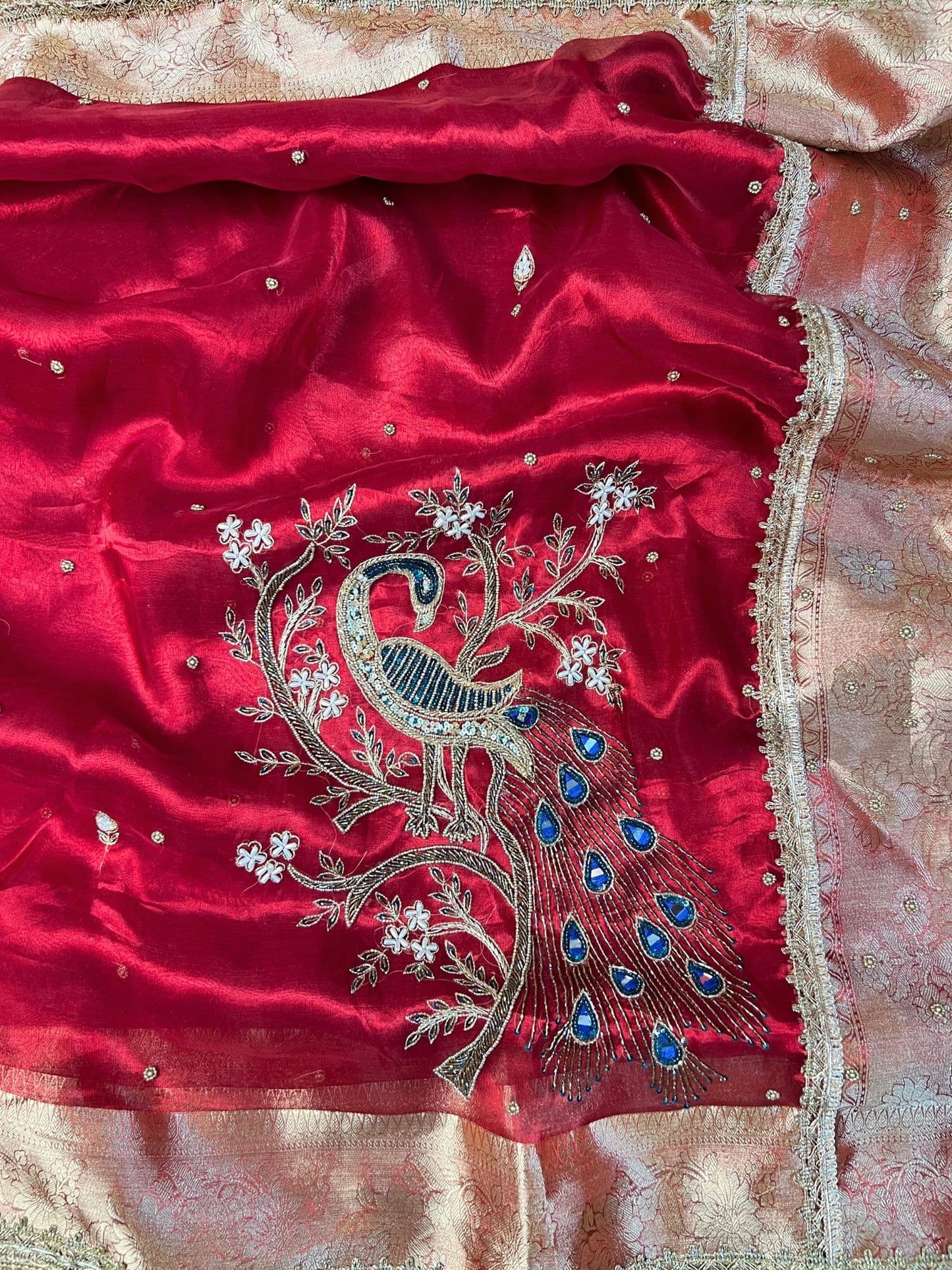 “Red Morni traditional Indian saree with intricate design”