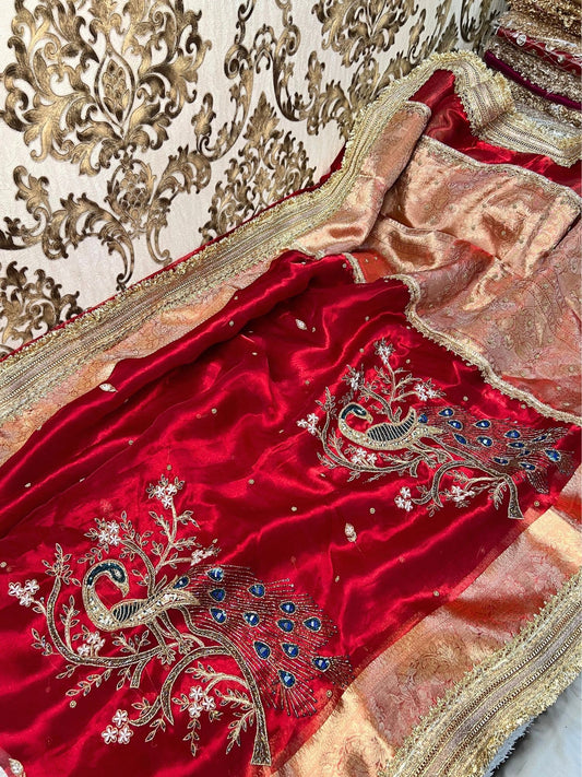 “Red Morni traditional Indian saree with intricate design”