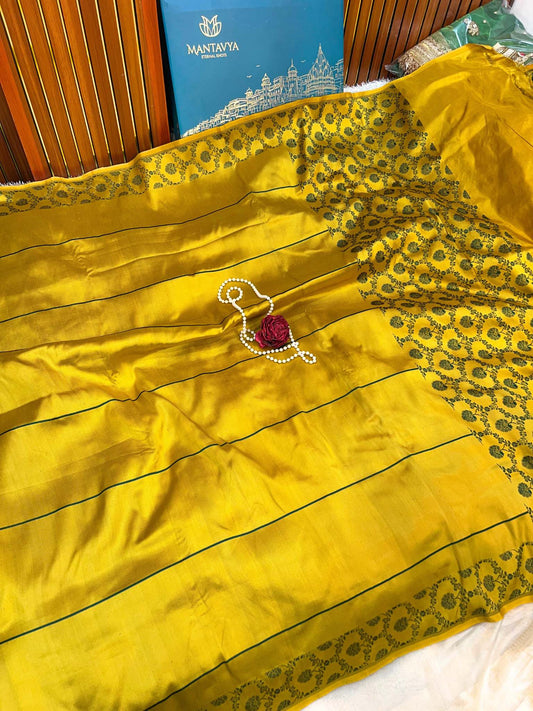Bright yellow silk saree with rich sheen and lightweight, luxurious feel – Mantavya Banaras.