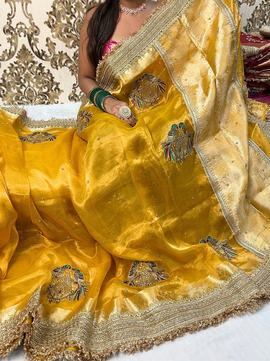 Yellow Tissue Silk Saree with hand-embroidered double parrot and leaf motifs, paired with a brocade blouse