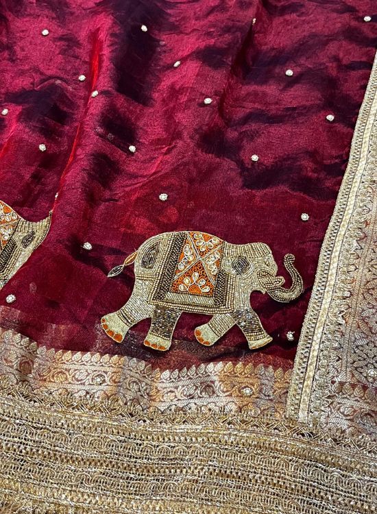 Hand-embroidered maroon tissue silk saree with golden elephant motifs – Banarasi traditional wear