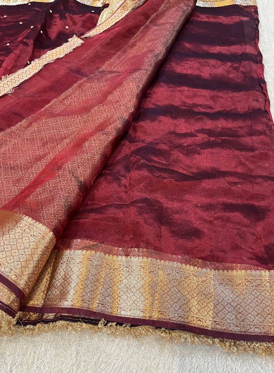 Hand-embroidered maroon tissue silk saree with golden elephant motifs – Banarasi traditional wear