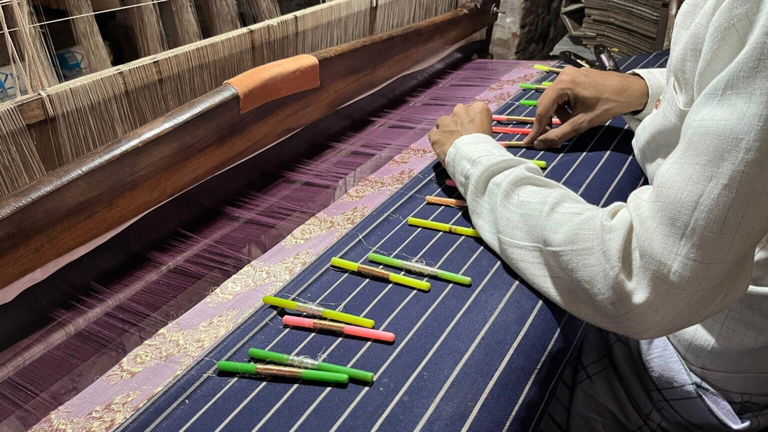Parts of a handloom including warp beam, heddles, reed, shuttle and treadles