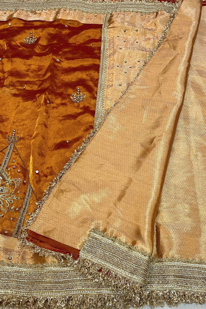 Gold Hand Embroidered Kanjivaram Tissue Silk Saree featuring intricate peacock motifs and unstitched brocade blouse, ideal for weddings and rituals.
