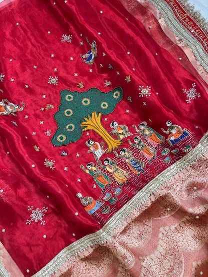 Royal Red tissue silk saree with zari border and traditional closeup view