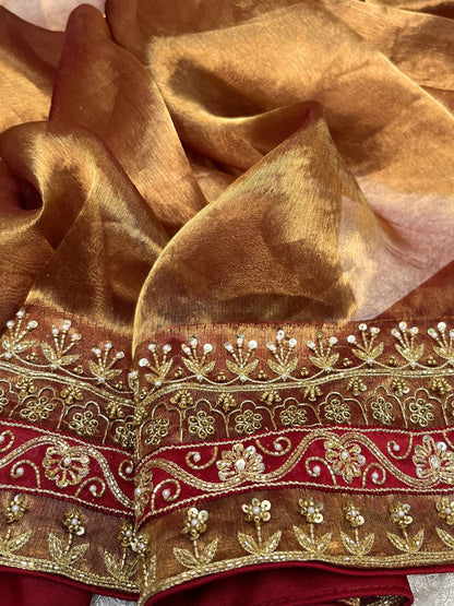 Hand Embroidered Copper Brown Banarasi Tissue Silk Saree with maroon patchwork border and matching embroidered blouse piece – perfect for weddings and festive occasions.