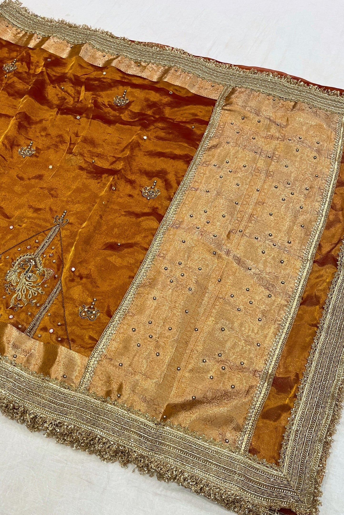 Gold Hand Embroidered Kanjivaram Tissue Silk Saree featuring intricate peacock motifs and unstitched brocade blouse, ideal for weddings and rituals.