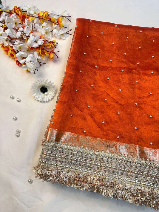 Manatavya Banaras orange tissue silk saree with subtle sheen, lightweight drape and elegant traditional craftsmanship