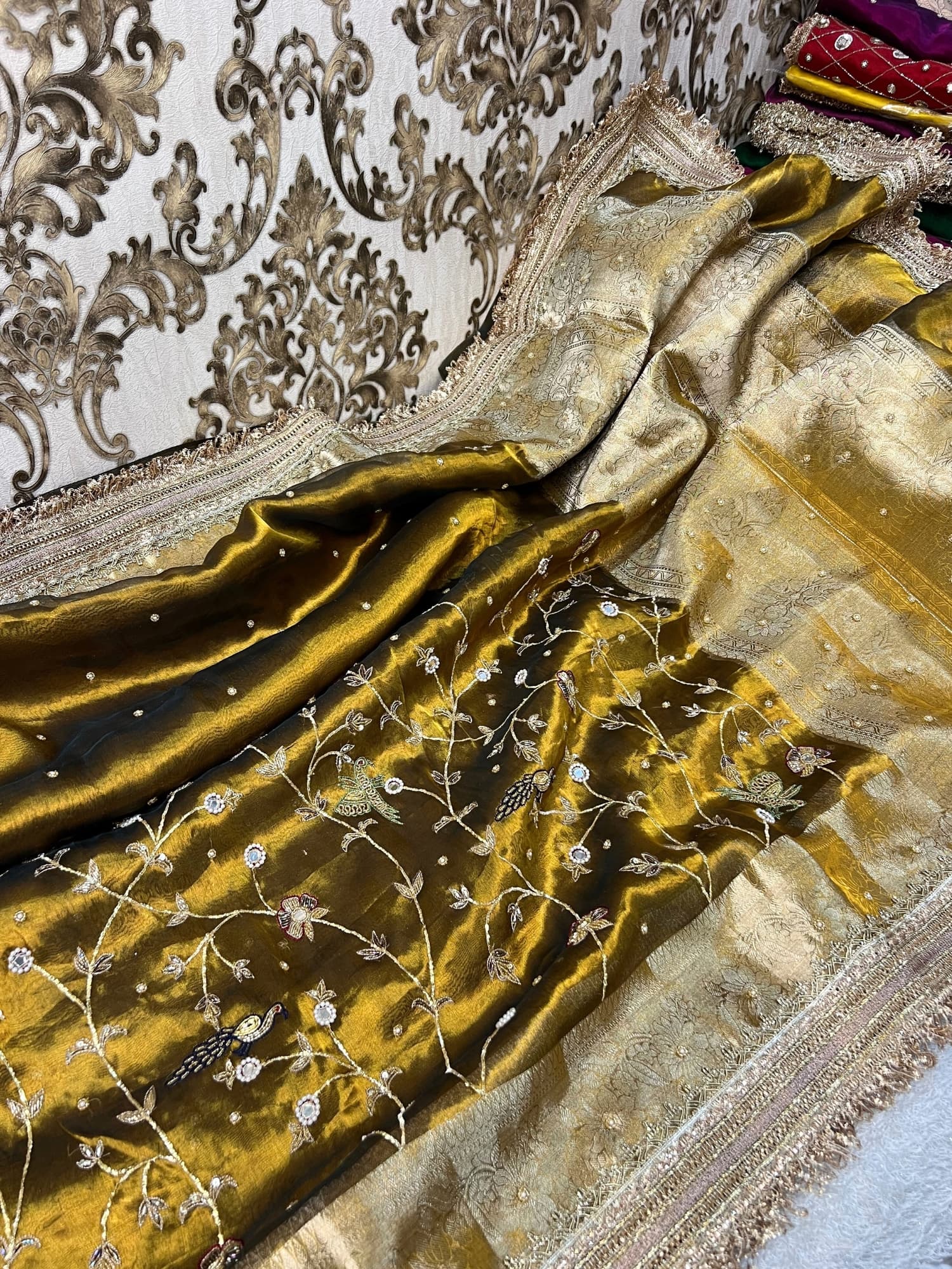 Gulmohar Mehendi green tissue silk saree with hand embroidery, birds and floral work, zari border