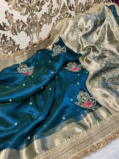 Blue Tissue Silk Saree with hand-embroidered Nazar motif featuring Om, lotus, floral, and moon designs in zari and threadwork