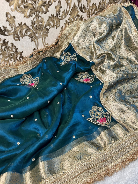 Blue Tissue Silk Saree with hand-embroidered Nazar motif featuring Om, lotus, floral, and moon designs in zari and threadwork