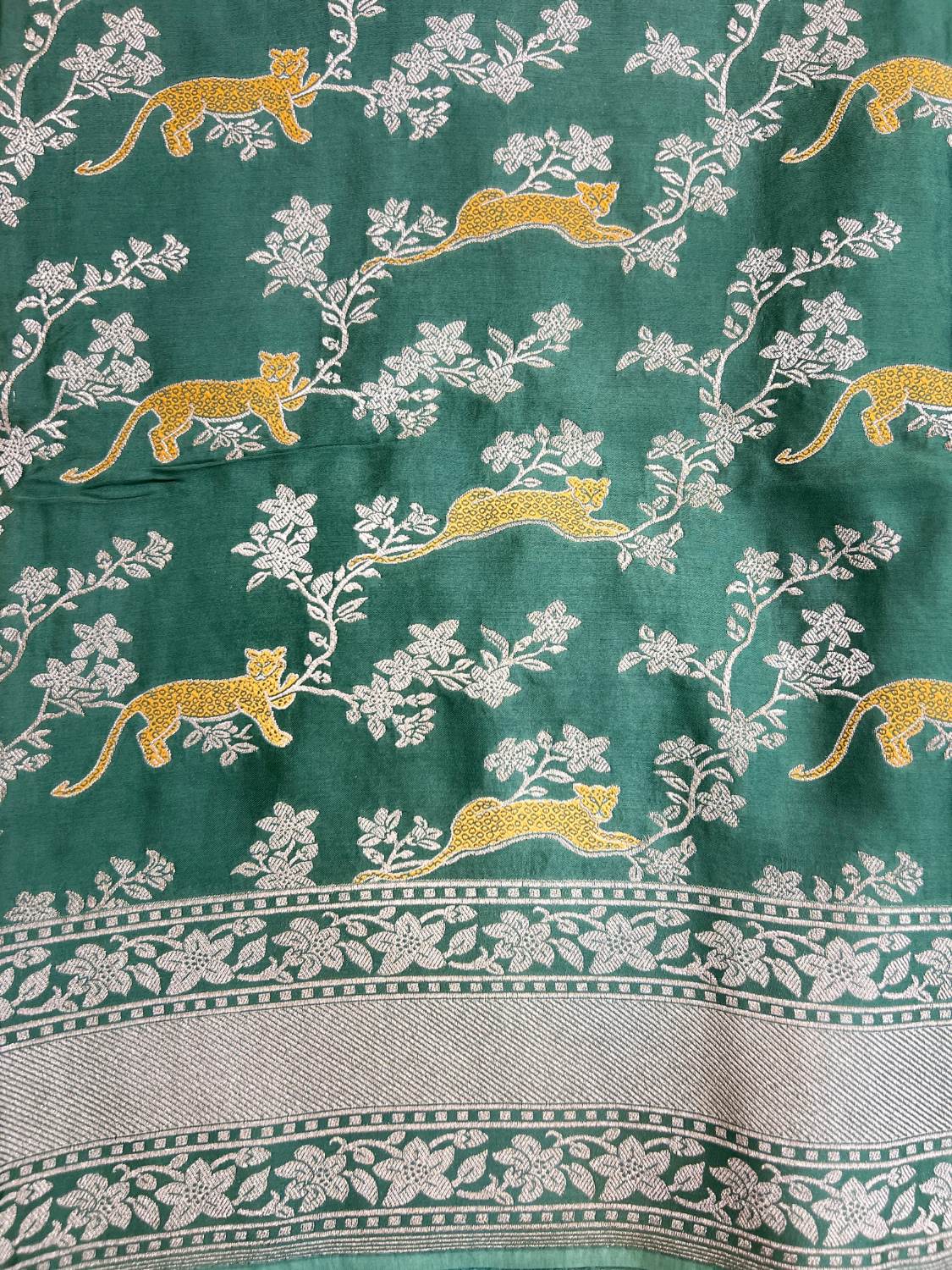Dark Green Tissue Silk Saree Mashru with Animal and Floral Jaal Closeup View 01