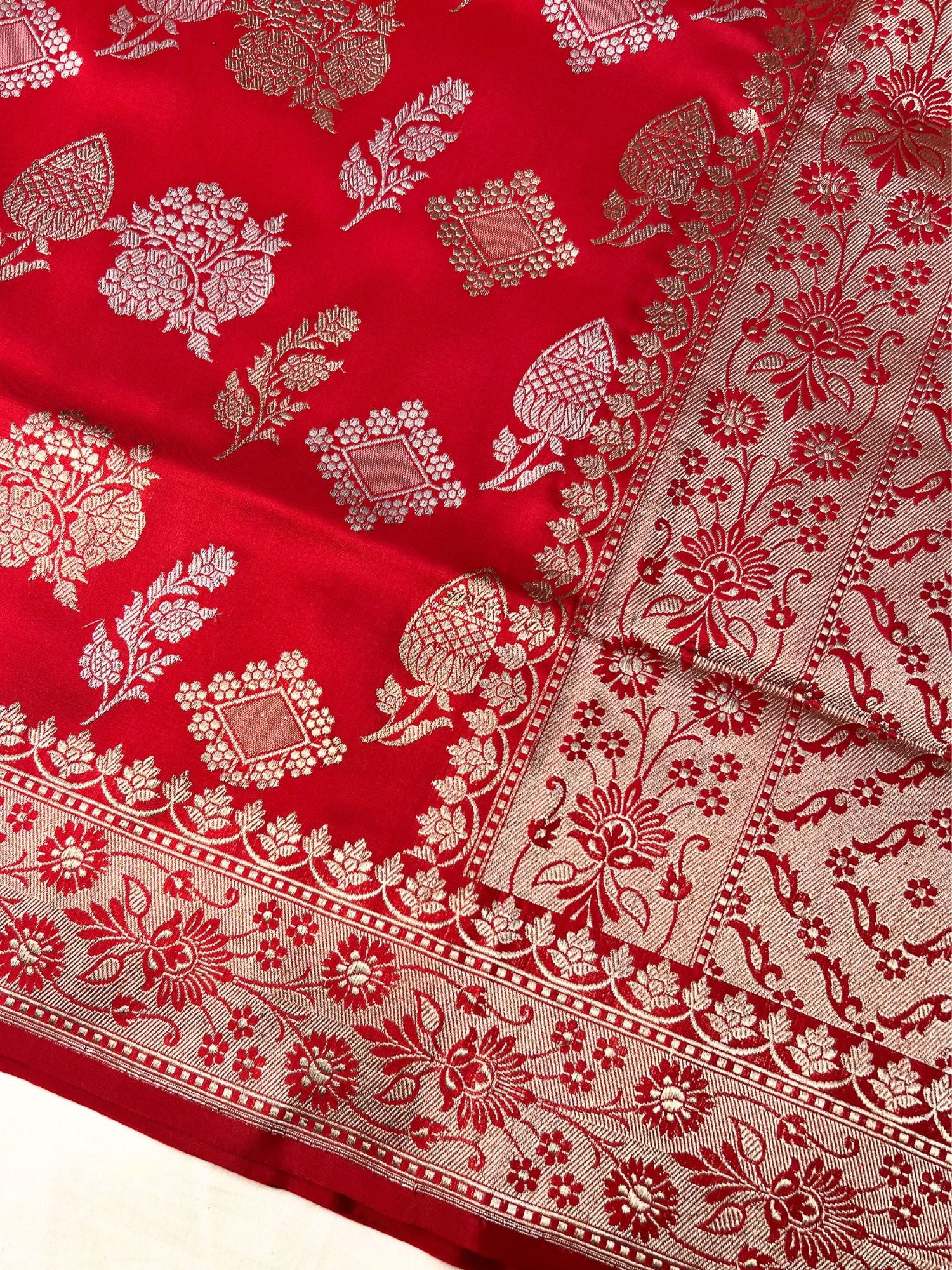 Red Katan Silk Saree With gold zari floral and buta closeup view