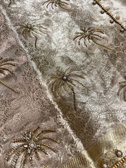 Manatavya Banaras ivory champagne Brocade tissue silk saree with intricate zari patterns, lightweight drape and elegant festive design