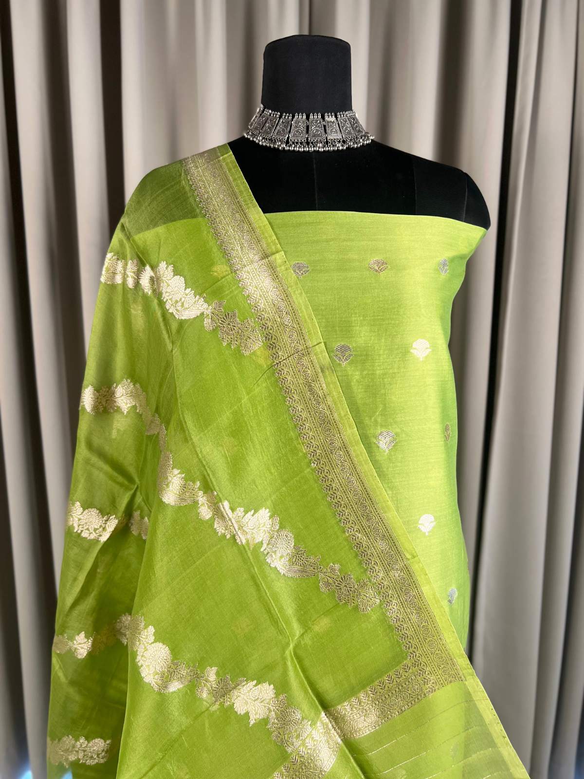 Lime Green Chiniya Suit with Golden Buti closeup view