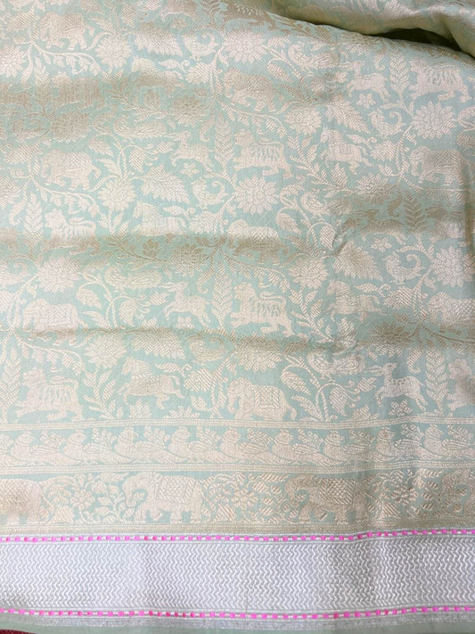 Pista Green Katan Silk Saree with floral vines and animal closeup view